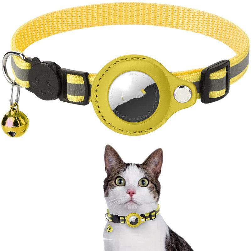 Yellow cat collar with reflective element and bell, worn by a cat on a white background