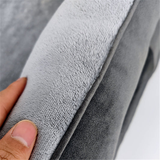 Close-up of gray fabric with a hand holding it, showing texture of an Orthopedic Dog Bed