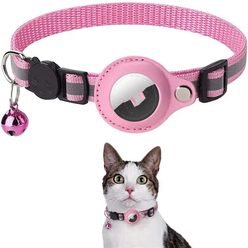 Pink reflective cat collar by Pawssibly Pets with bell and safety buckle on a curious cat