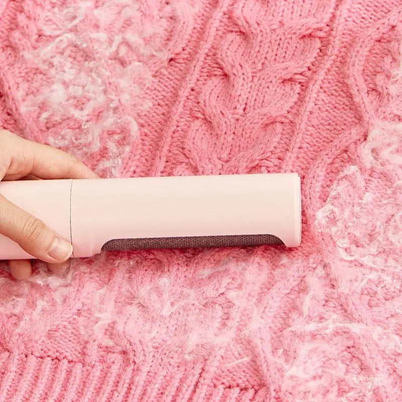 Pawssibly Pets reusable pet hair remover cleaning white pet hair from pink knitted fabric