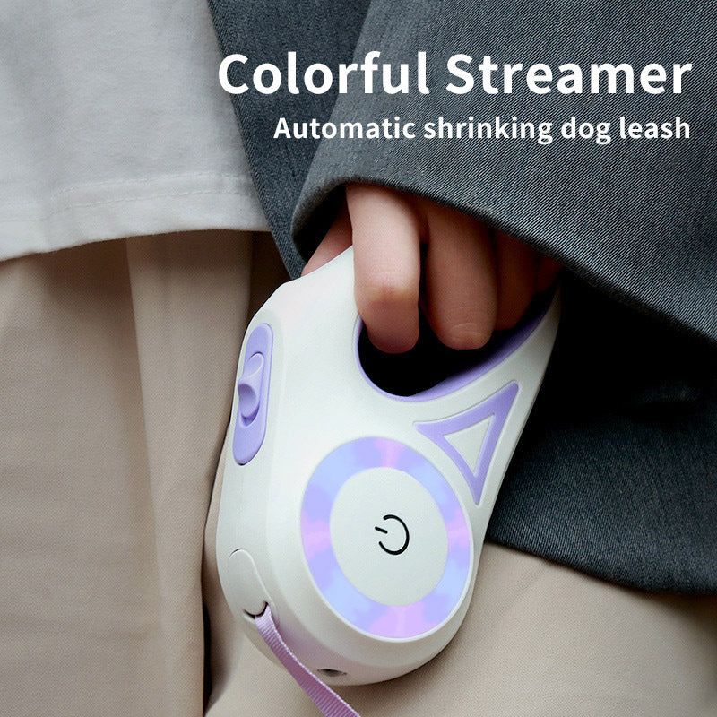 Automatic retractable dog leash with colorful streamer held by a person