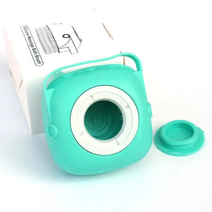 Silicone dog bath brush in teal with ergonomic handle and detachable cap for easy cleaning