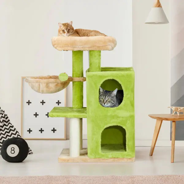 Green and beige cat tree tower with two cats inside a room.