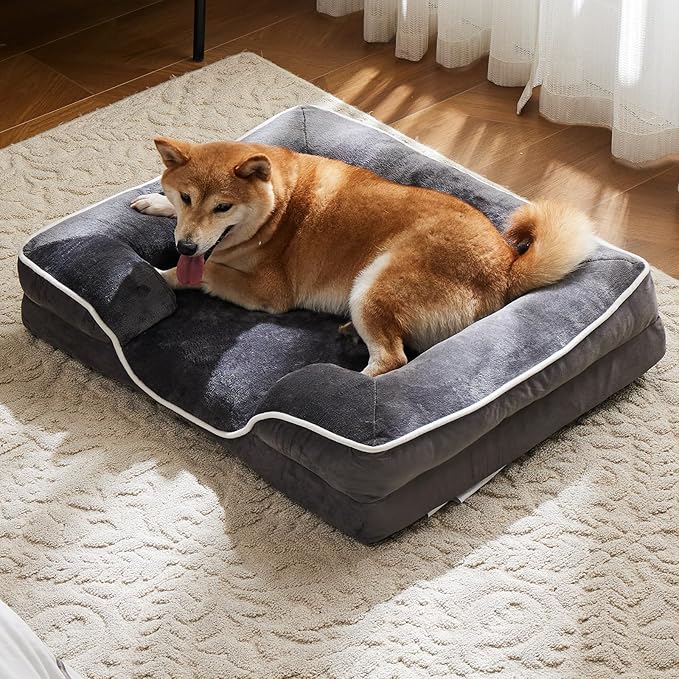 Dog lying on a gray Orthopedic pet bed in a room with curtains and wooden floor.