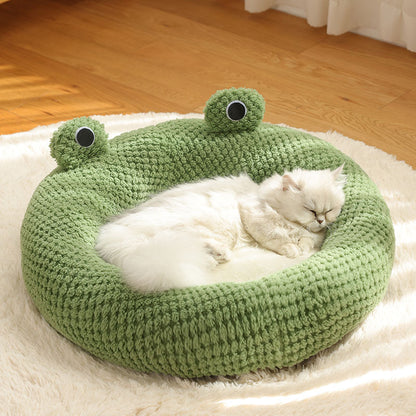 A white cat lying in a Plush cat bed 