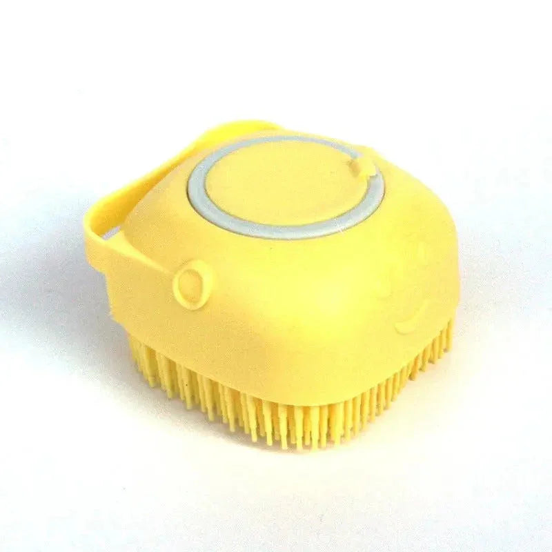 Yellow Silicone dog bath brush with bristles on a white background