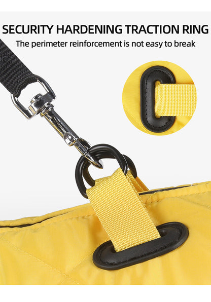 Yellow bag with security hardening traction ring and strap, emphasizing durability of a dog winter coat.