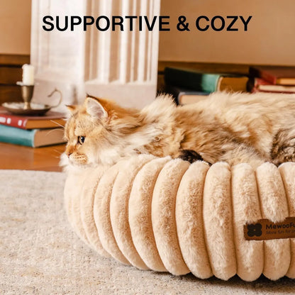 Pawssibly Pets donut cat bed in beige color with fluffy cat relaxing inside for safety and comfort